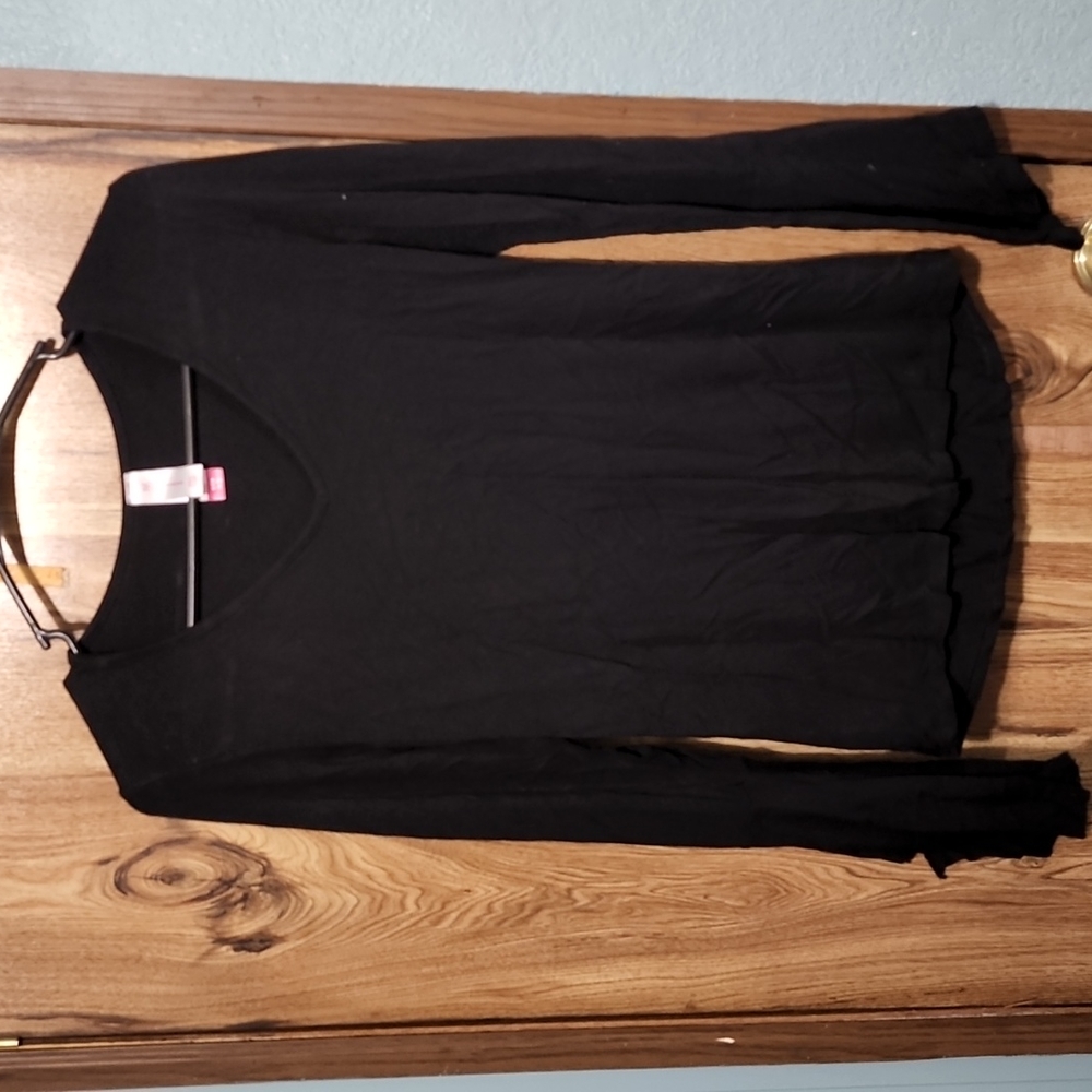 Black top with flared cuffs.